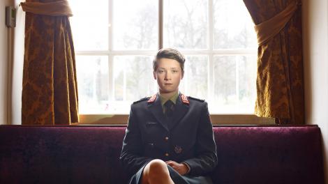 Photo of a cadet sitting in a room